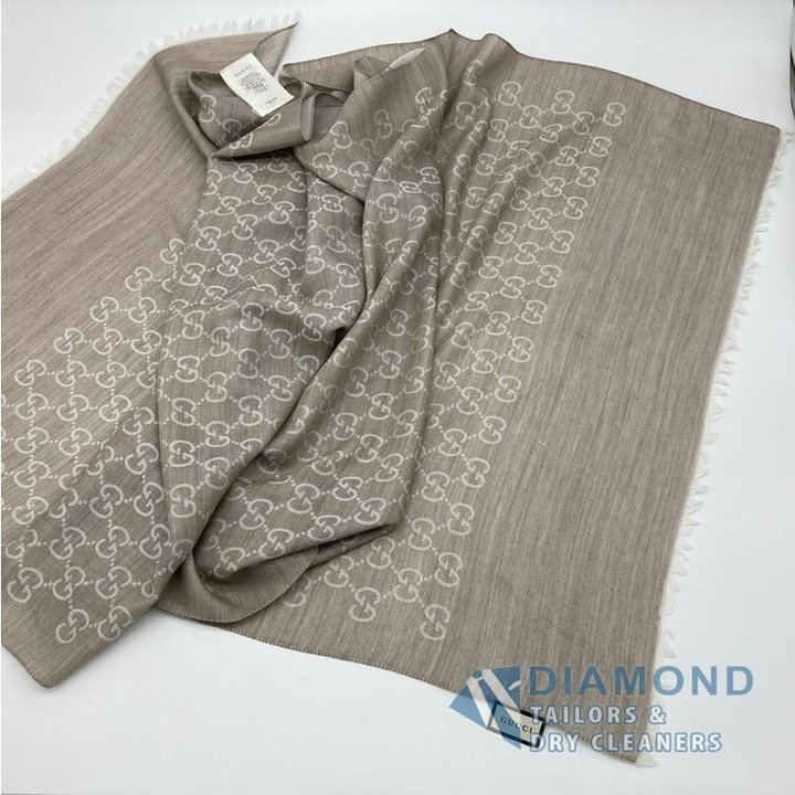 A Gucci GG wool-silk scarf after stain removal