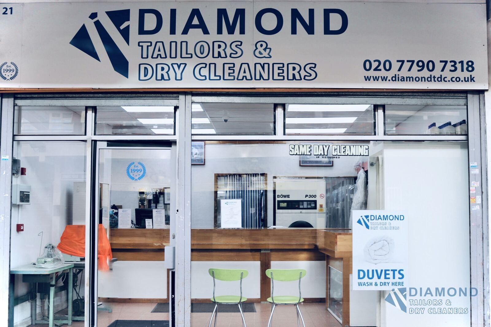 The Diamond Tailors & Dry Cleaners shopfront at 21 Watney Market, London E1, with the counter and dry-cleaning machine visible inside